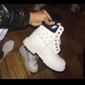 All white customized timberlands with spikes